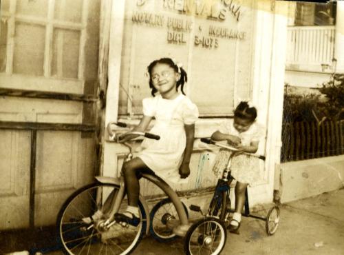 Joenelle and Millicent in front of business store