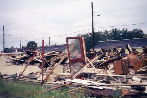 Ansonborough Homes demolition with door standing open amid debris